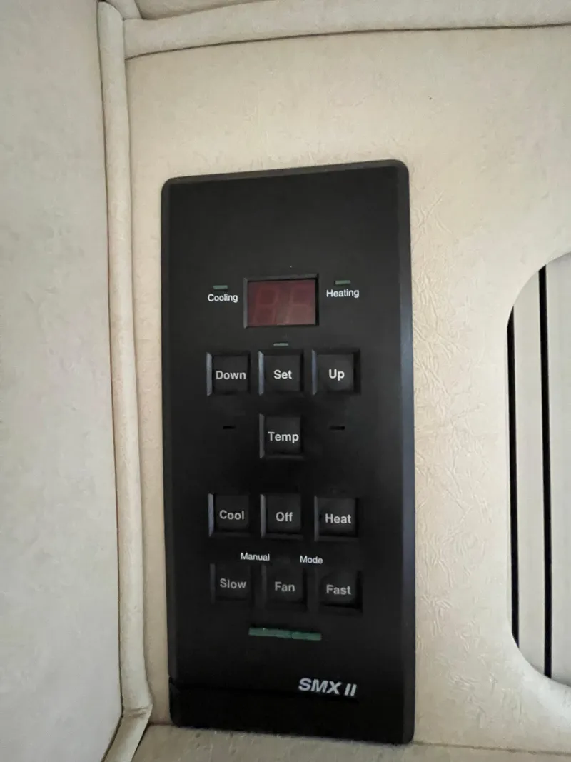 Slide: The Image of Control panel for SMX II climate system in 2001 Sea Ray 310 Sundancer boat. - 25