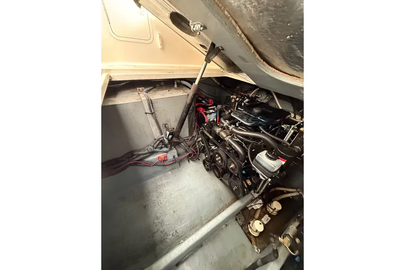 Slide: The Image of Engine compartment of a 2001 Sea Ray Sundancer 310 boat, showcasing mechanical components. - 55