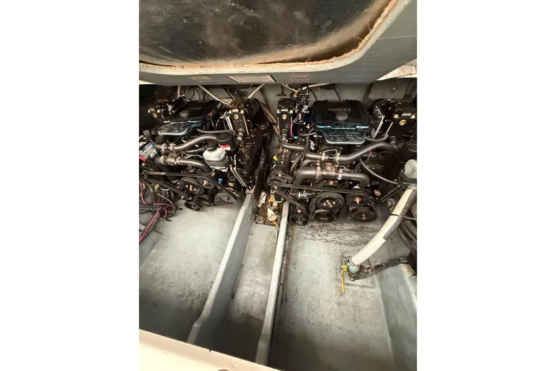 Slide: The Image of Engine compartment of a 2001 Sea Ray Sundancer 310 boat, showcasing dual engines. - 56
