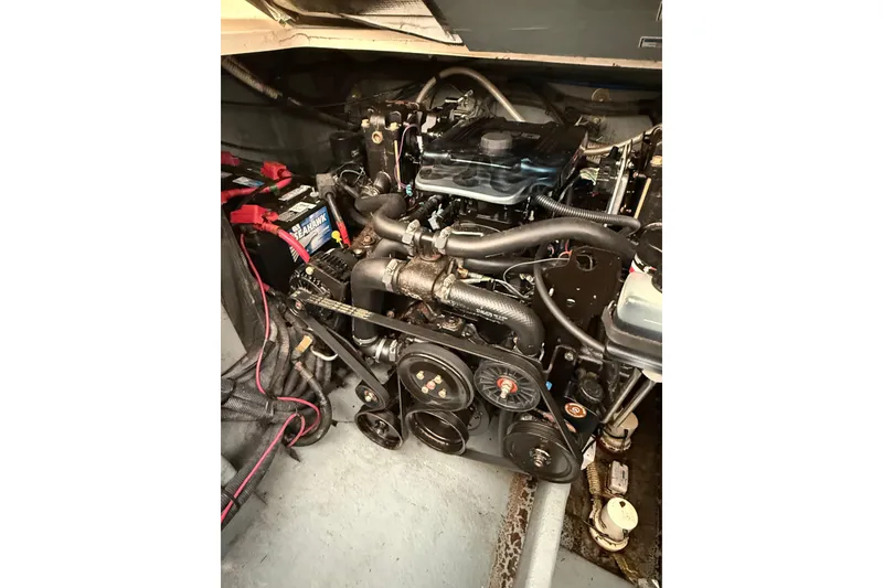 Slide: The Image of Engine compartment of a 2001 Sea Ray Sundancer 310 boat, showcasing mechanical components. - 57