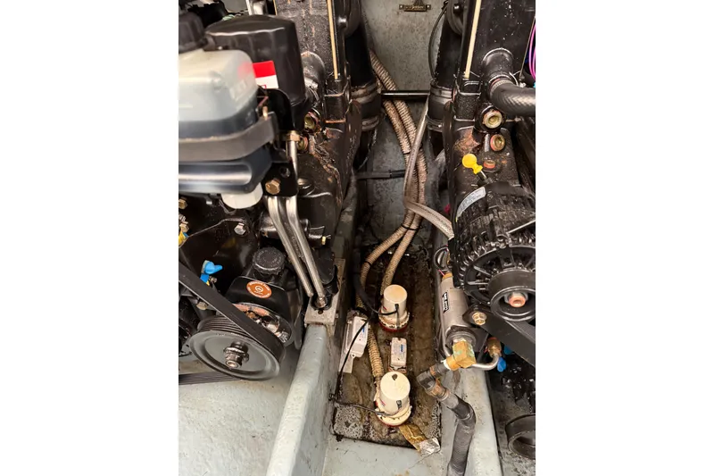 Slide: The Image of Engine compartment of a 2001 Sea Ray Sundancer 310 boat, showing mechanical components. - 60