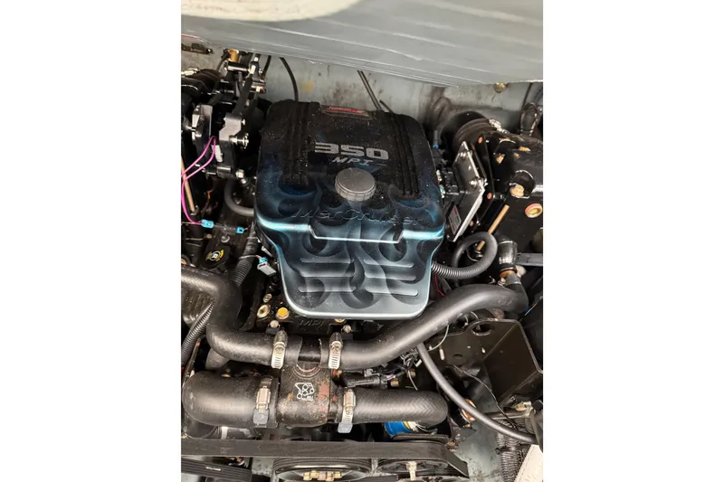 Slide: The Image of Engine of a 2001 Sea Ray Sundancer 310 boat, featuring a 350 MPI motor. - 61