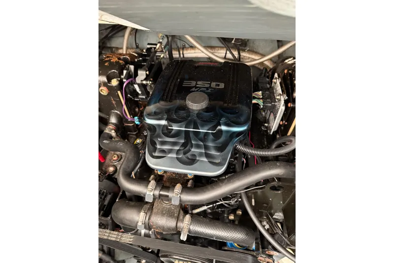 Slide: The Image of Engine of a 2001 Sea Ray Sundancer 310 boat, featuring a 350 MPI motor. - 62