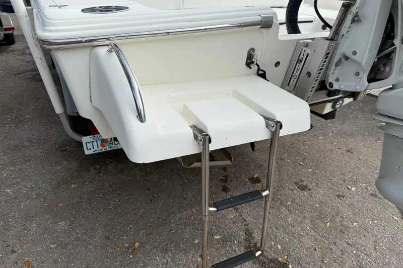 Slide: The Image of 2003 Scout 240 Bay Scout boat with swim platform and ladder. - 14