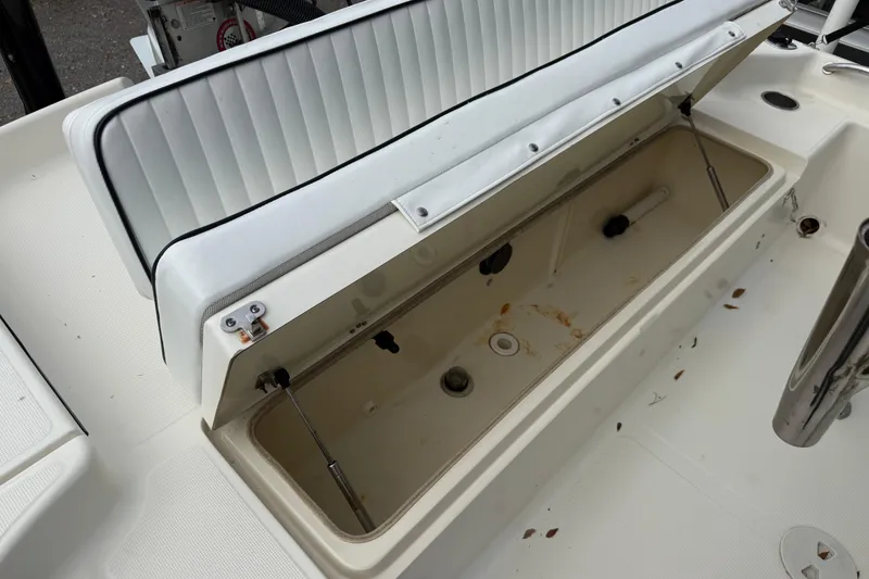 Slide: The Image of Open storage compartment on a 2003 Scout 240 Bay Scout boat. - 24