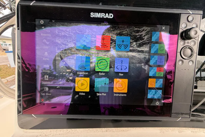 Slide: The Image of Simrad marine display on 2003 Scout 240 Bay Scout, showing navigation and sonar options. - 32