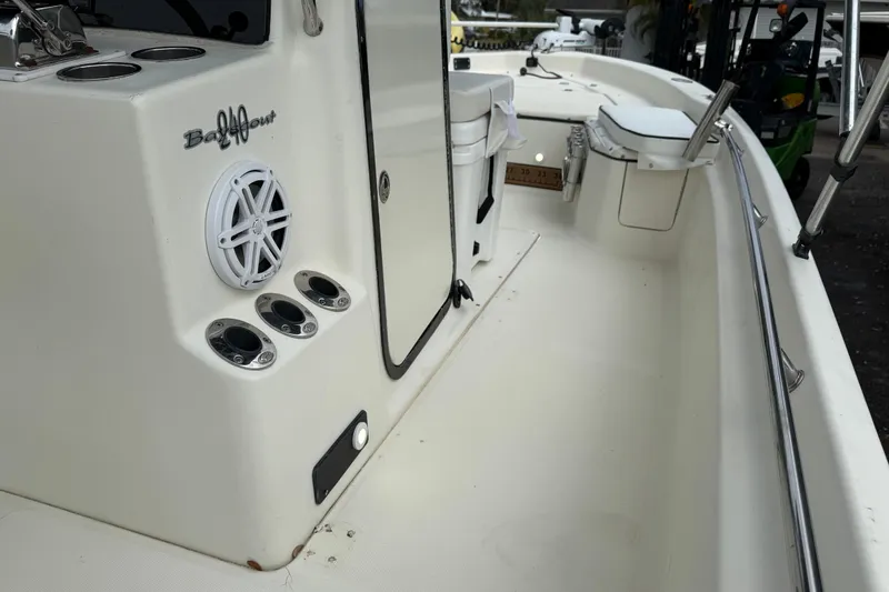 Slide: The Image of 2003 Scout 240 Bay Scout boat interior with speaker and rod holders. - 34