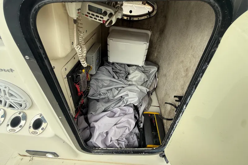 Slide: The Image of Interior of a 2003 Scout 240 Bay Scout boat showing storage and equipment. - 37