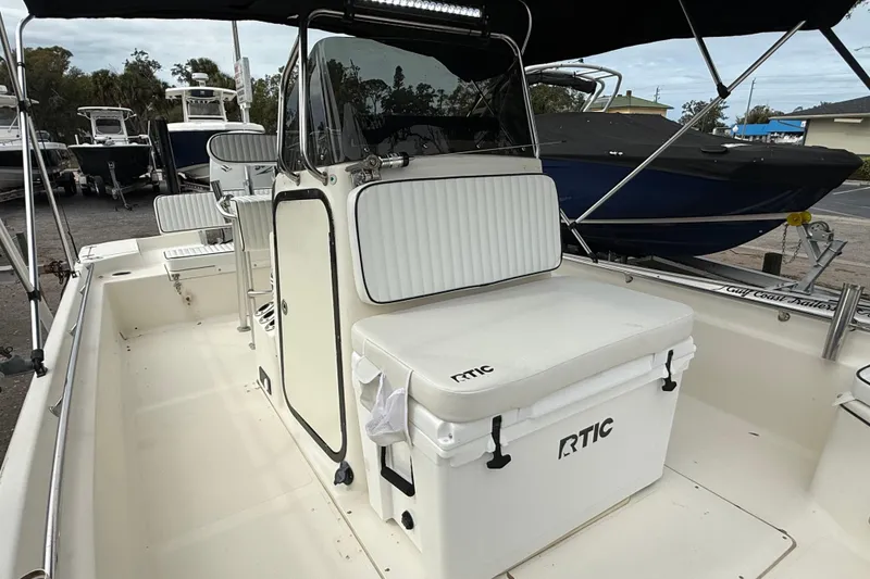 Slide: The Image of 2003 Scout 240 Bay Scout boat interior with RTIC cooler and seating. - 41