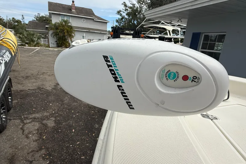 Slide: The Image of Minn Kota Riptide motor on 2003 Scout 240 Bay Scout boat, parked outdoors. - 45