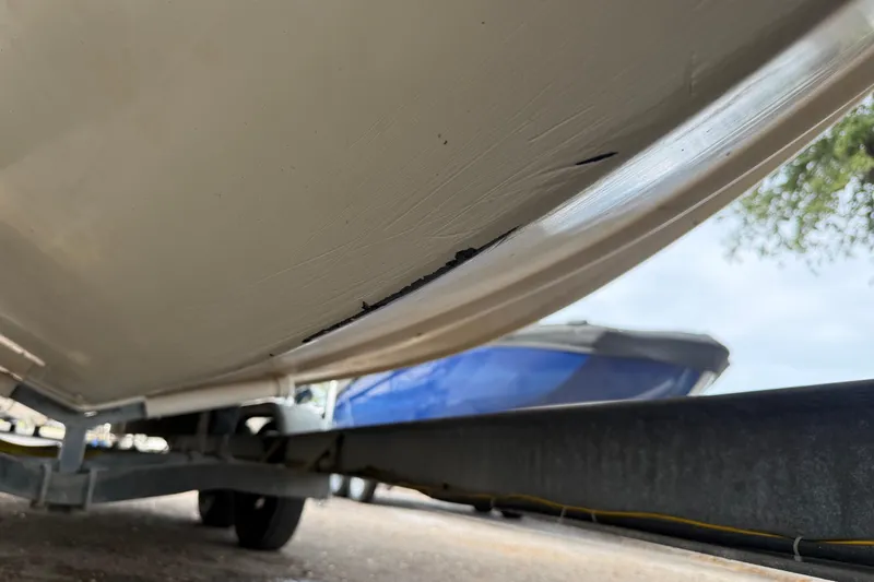 Slide: The Image of 2003 Scout 240 Bay Scout boat hull on trailer, showing underside detail. - 9