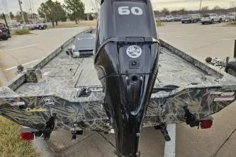 Slide: The Image of 2016 Lowe Stinger 175 boat with 60 HP motor in parking lot. - 5
