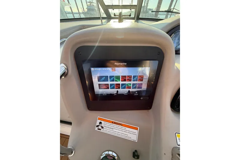 Slide: The Image of Control panel of a 2006 Sea Ray 340 Sundancer with Raymarine display. - 18