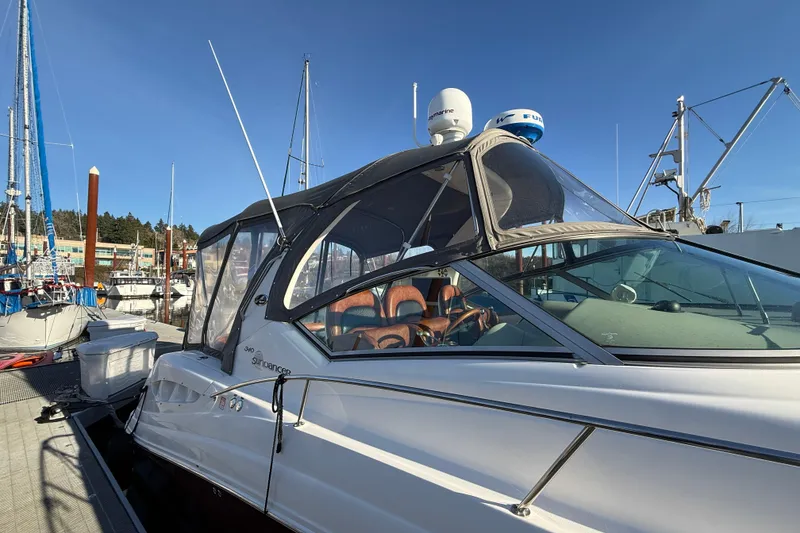 Slide: The Image of 2006 Sea Ray 340 Sundancer docked at marina under clear blue sky. - 7