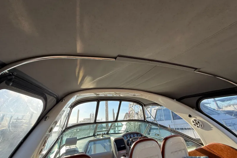 Slide: The Image of Interior view of 2006 Sea Ray 340 Sundancer boat cockpit with helm and seating. - 8