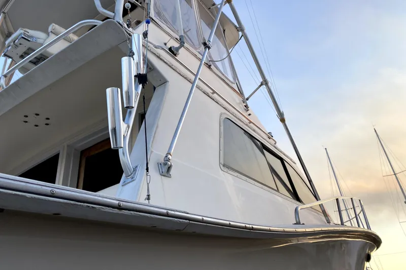 Slide: The Image of 1991 Pacemaker 37 Sportfisherman boat, sleek design, docked at sunset. - 23