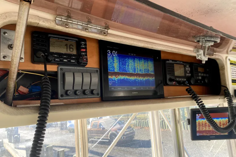 Slide: The Image of 1991 Pacemaker 37 Sportfisherman dashboard with navigation and communication equipment. - 9