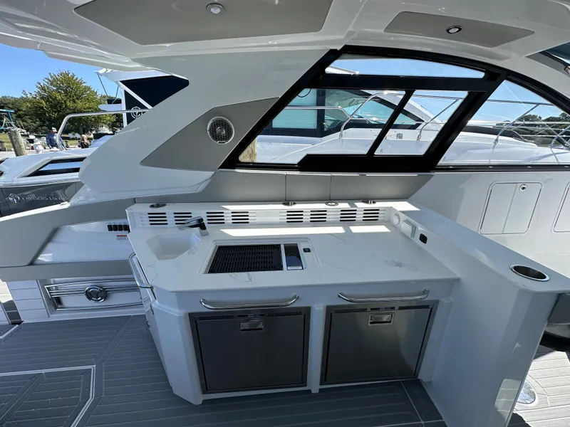 Slide: The Image of 2026 Cruisers Yachts 42 GLS OB interior with seating and counter space. - 14