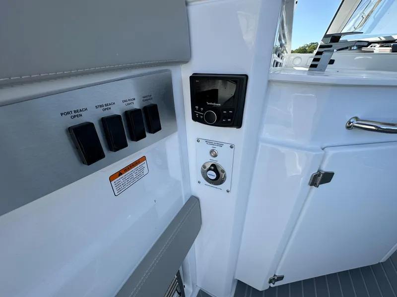 Slide: The Image of Helm of 2026 Cruisers Yachts 42 GLS OB with dual Simrad displays and modern controls. - 15