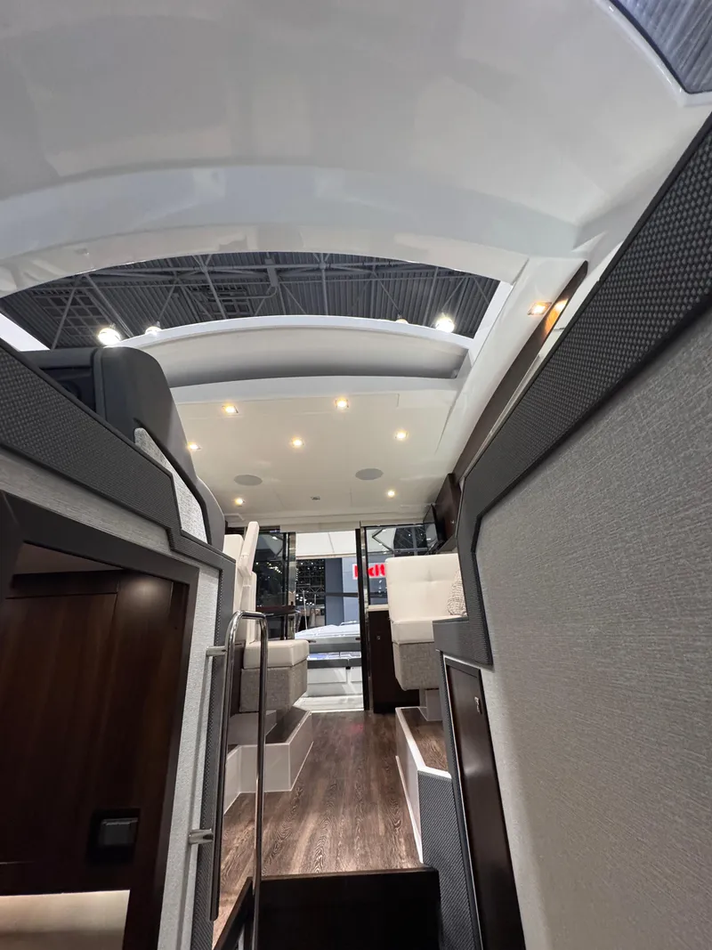 Slide: The Image of Interior view of 2024 Cruisers Yachts 42 Cantius, featuring modern design and ambient lighting. - 13