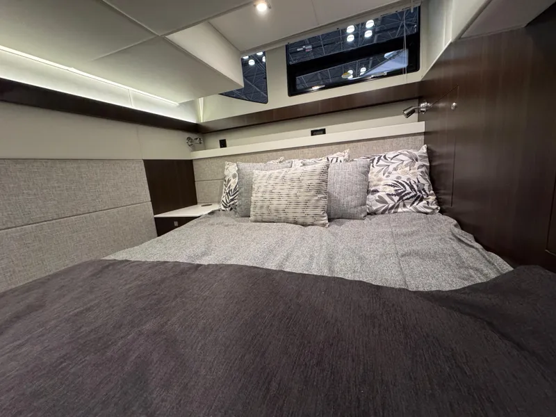 Slide: The Image of 2024 Cruisers Yachts 42 Cantius bedroom with modern decor and plush bedding. - 15