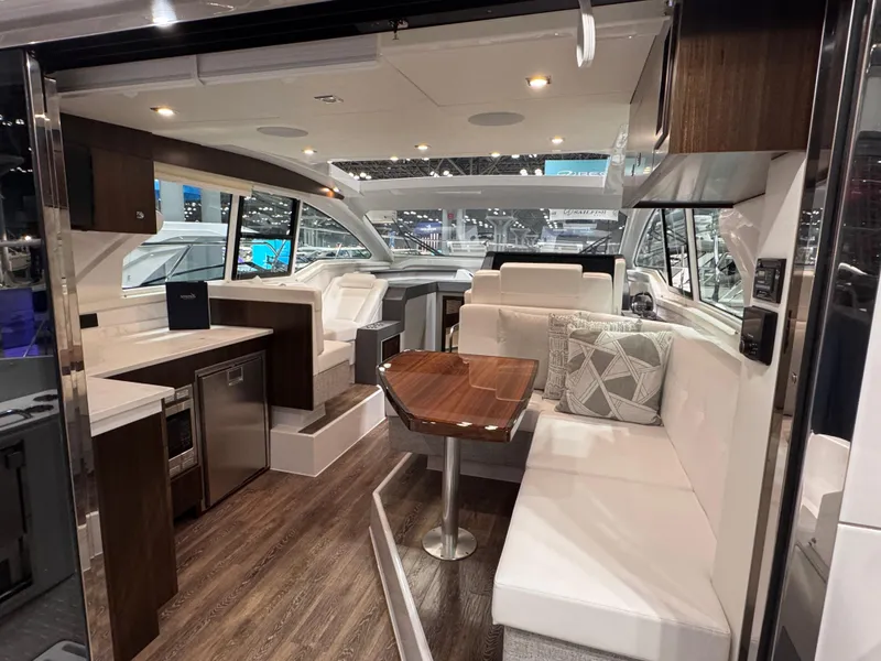 Slide: The Image of Luxurious interior of 2024 Cruisers Yachts 42 Cantius with modern seating and elegant design. - 7