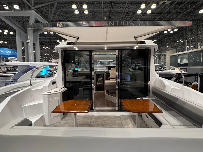 Slide: The Image of 2024 Cruisers Yachts 42 Cantius luxury boat interior with seating and tables. - 9