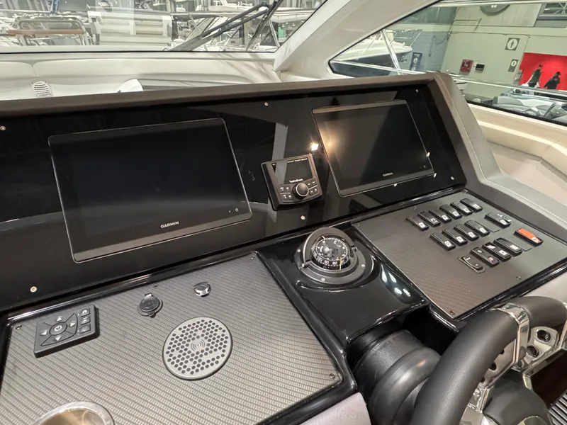 Slide: The Image of 2024 Cruisers Yachts 42 Cantius helm with advanced navigation displays and controls. - 11