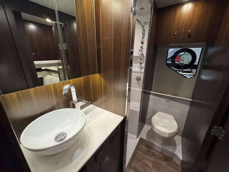 Slide: The Image of Luxurious bathroom in 2024 Cruisers Yachts 42 Cantius, featuring modern sink and toilet. - 17