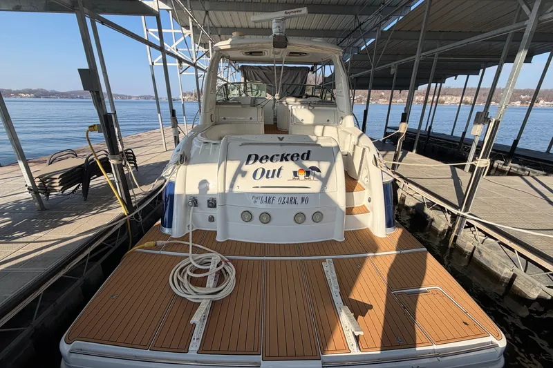 Slide: The Image of Logo of Ozark Yachts & Motorsports, featuring a stylized yacht and bold text. - 1