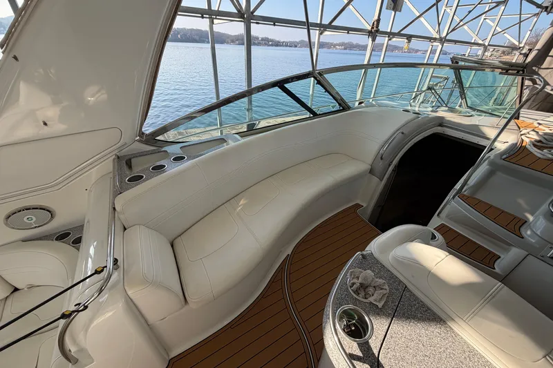 Slide: The Image of 2005 Formula 48 Yacht cockpit with navigation instruments and wooden steering wheel. - 14