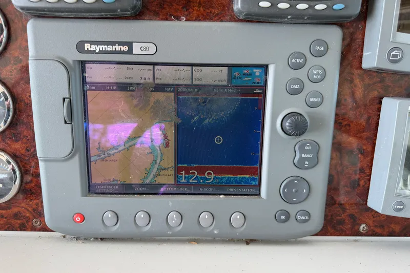 Slide: The Image of Control panel of a 2005 Formula 48 Yacht with Raymarine and Bennett displays. - 17