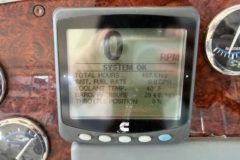 Slide: The Image of 2005 Formula 48 Yacht docked under covered marina, showcasing sleek design and spacious deck. - 20