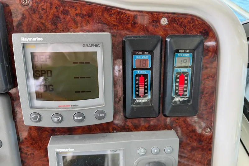 Slide: The Image of Luxurious interior of a 2005 Formula 48 Yacht with white seating and scenic water view. - 23