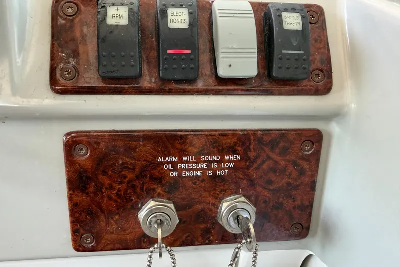 Slide: The Image of 2005 Formula 48 Yacht cockpit with helm, sink, and storage compartments. - 24