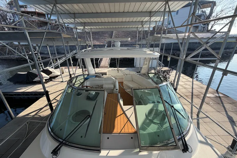 Slide: The Image of 2005 Formula 48 Yacht interior with open fridge, granite countertop, and white seating. - 26