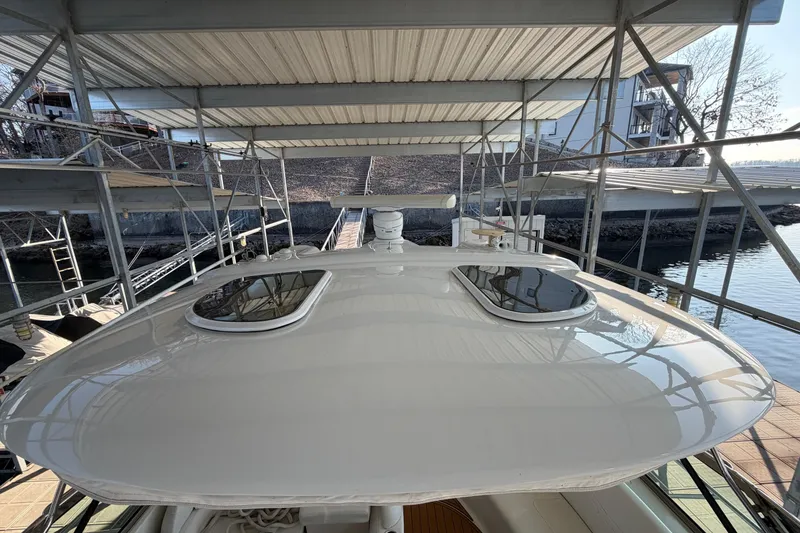 Slide: The Image of Luxurious interior of a 2005 Formula 48 Yacht with leather seating and wood finishes. - 28