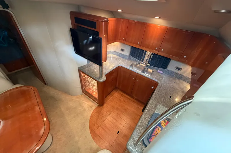 Slide: The Image of 2005 Formula 48 Yacht bathroom with wooden cabinetry and mirrored vanity. - 34