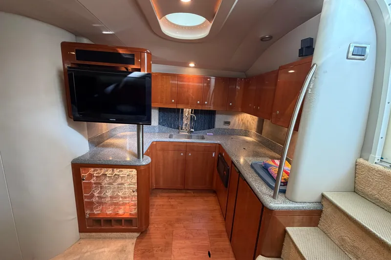 Slide: The Image of Luxurious interior of a 2005 Formula 48 Yacht with vanity, mirrors, and elegant wood finishes. - 37