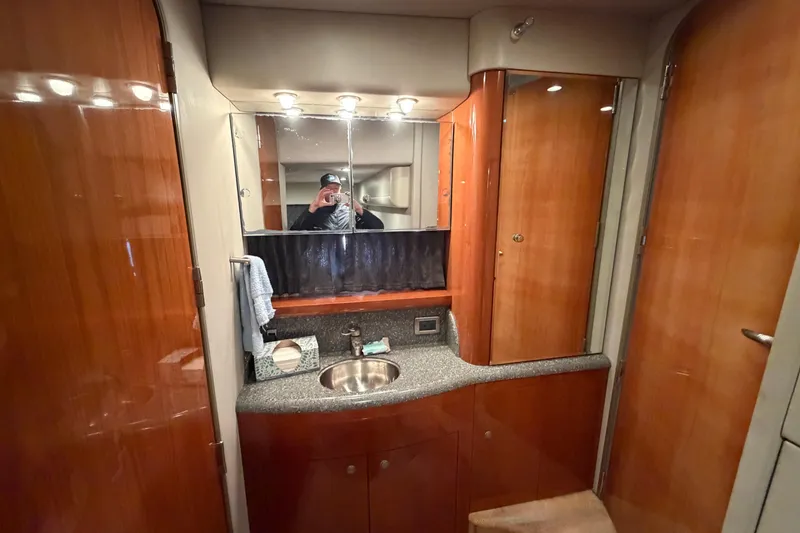 Slide: The Image of Engine room of a 2005 Formula 48 Yacht, showcasing mechanical components and layout. - 43