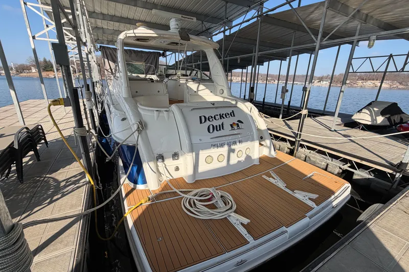 Slide: The Image of 2005 Formula 48 Yacht docked under covered marina with metal framework. - 9