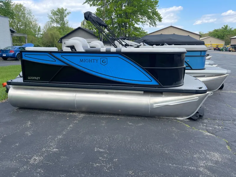 The Image of 2026 Godfrey MG1476C pontoon boat parked outdoors. - 1