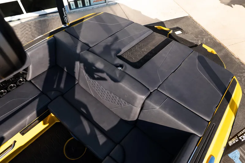 Slide: The Image of 2026 MasterCraft NXT23 boat interior with sleek black seating and modern design. - 12