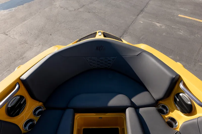 Slide: The Image of 2026 MasterCraft NXT23 boat interior with yellow and black seating. - 24