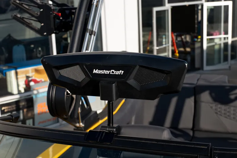 Slide: The Image of 2026 MasterCraft NXT23 boat dashboard with logo, showcasing modern design features. - 26