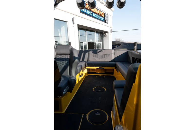 Slide: The Image of Interior of 2026 MasterCraft NXT23 boat with sleek seating and modern design. - 27