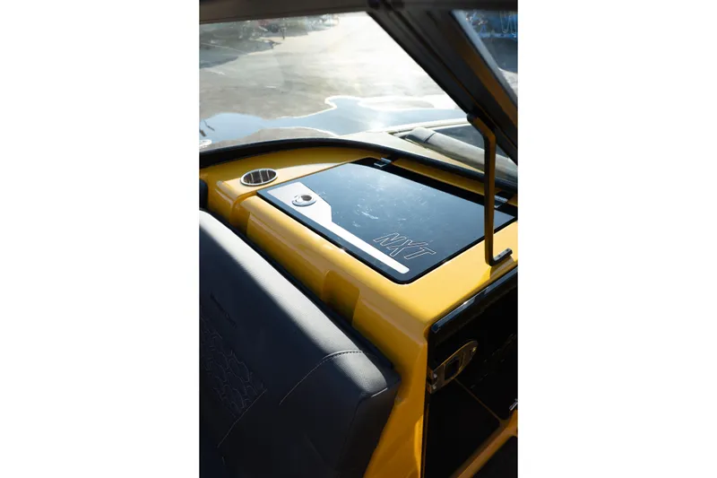 Slide: The Image of 2026 MasterCraft NXT23 boat dashboard with sleek design and modern features. - 31