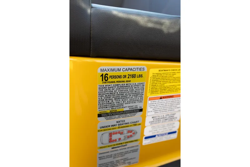 Slide: The Image of 2026 MasterCraft NXT23 capacity label, maximum 16 persons or 2160 lbs, safety instructions. - 33