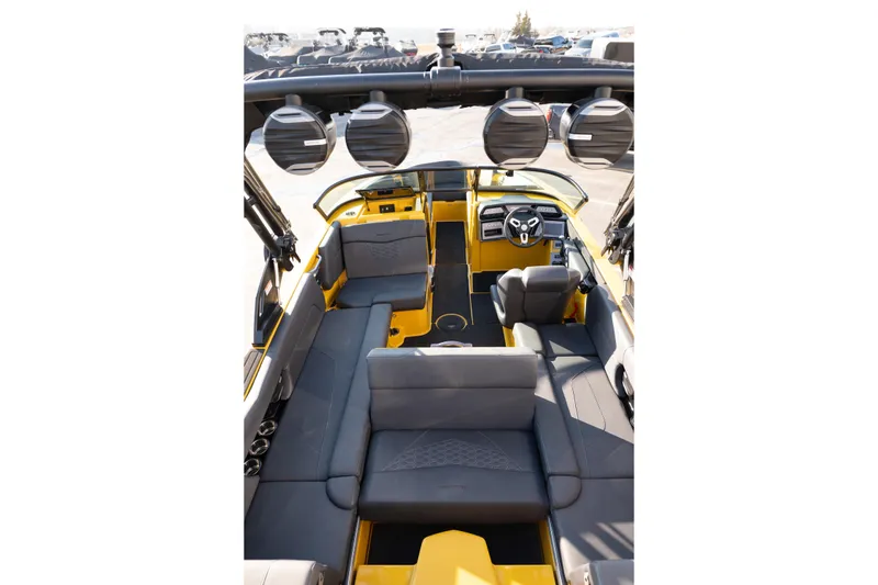 Slide: The Image of 2026 MasterCraft NXT23 boat interior with sleek seating and modern dashboard design. - 34