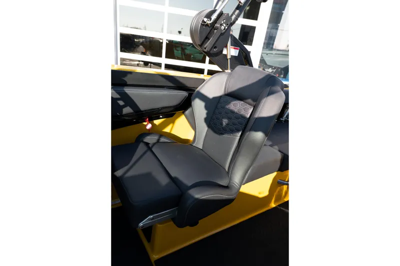 Slide: The Image of 2026 MasterCraft NXT23 boat seat with black upholstery and honeycomb pattern. - 37